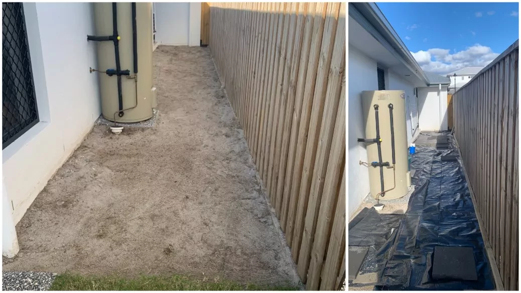 Side yard beside house prepped with sand base and weed mat for paving install